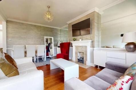 A stylish and inviting living room featuring co...