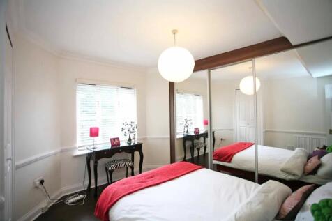 A bright and inviting double bedroom featuring ...