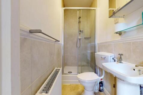 A clean and well-maintained bathroom featuring ...