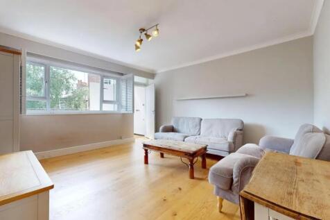 A bright and inviting living room featuring nat...