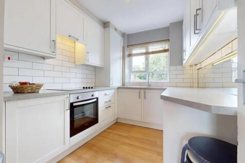 Bright and modern kitchen featuring a clean des...