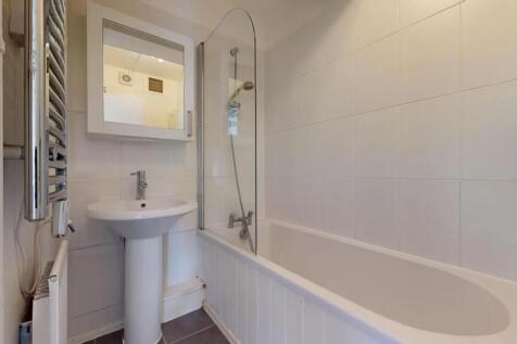 A clean and modern bathroom featuring a white b...