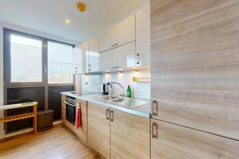 Bright and modern kitchen featuring wood-style ...