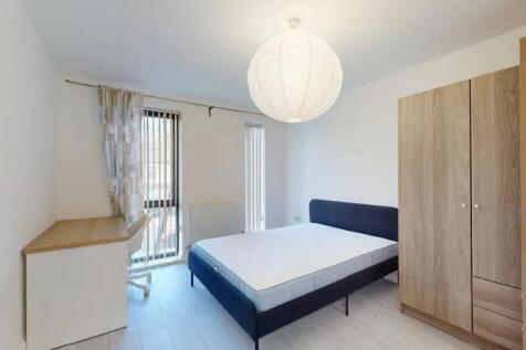 Bright and modern double bedroom featuring a co...