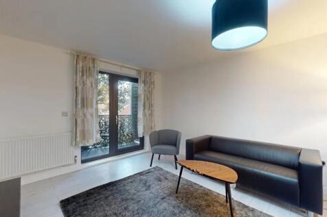 Bright and modern living room featuring a sleek...