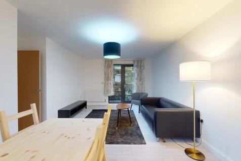 Bright and modern living room featuring a sleek...