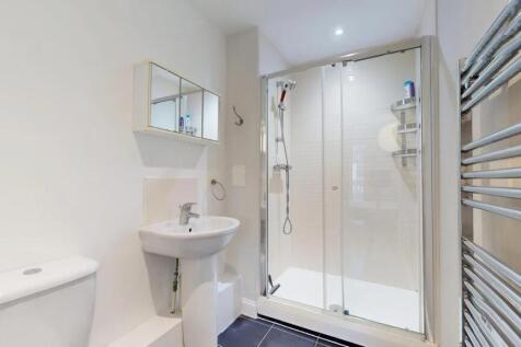 Bright and clean modern bathroom featuring a sp...