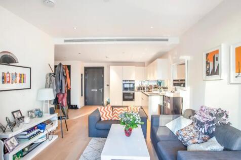 Bright and contemporary living room featuring m...