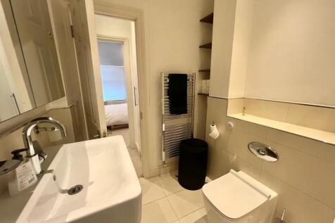 A modern and well-maintained bathroom featuring...