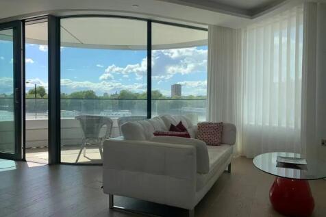 Bright and modern living room featuring a styli...