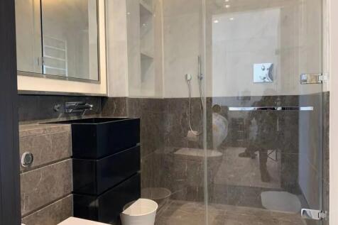 A modern bathroom suite featuring elegant marbl...
