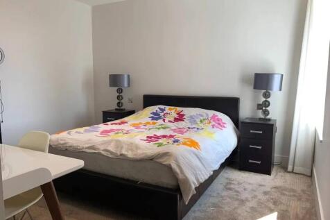 Bright and tidy double bedroom featuring a comf...
