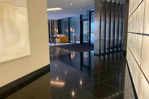 A sleek and modern reception area featuring glo...