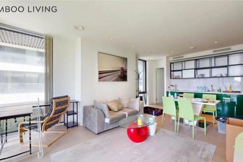 A bright and modern living space featuring larg...