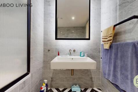 A modern bathroom featuring sleek gray marble t...