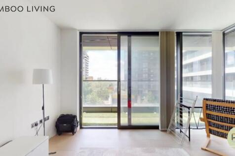 A bright and airy modern room with large floor-...