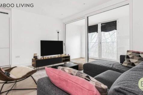 A modern and stylish living room featuring a la...