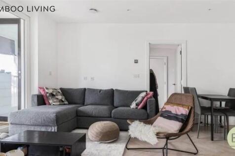 Bright and modern living room featuring a spaci...