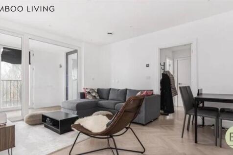 A modern and stylish living room featuring a co...