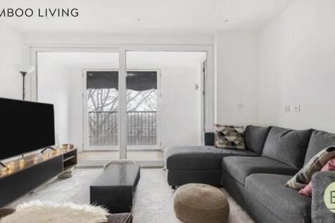 Bright and modern living room featuring a spaci...