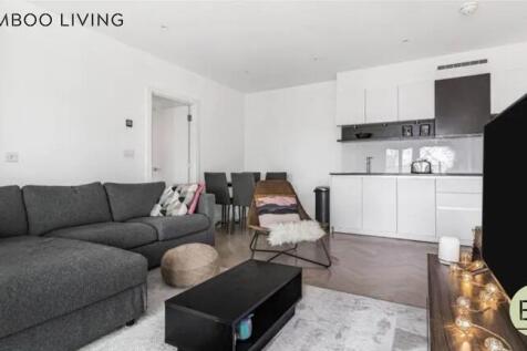 Bright and modern living room featuring a spaci...
