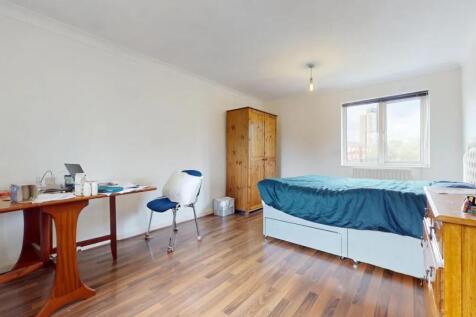 Bright and spacious master bedroom featuring a ...