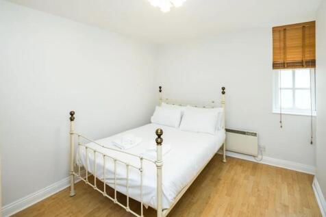 Bright and tidy double bedroom featuring a styl...