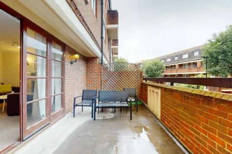 Outdoor balcony area with seating overlooking n...