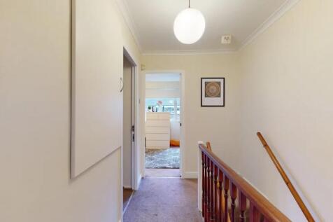 A clean and well-maintained hallway featuring n...