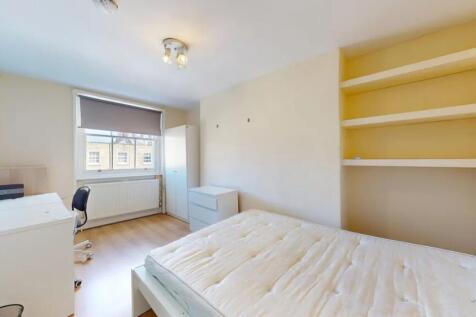 Bright and tidy double bedroom featuring a comf...