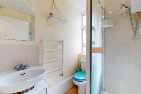Bright and functional bathroom featuring a walk...