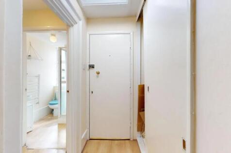 A clean and well-maintained hallway featuring l...