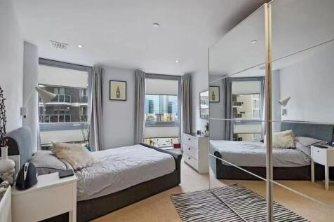 Bright and modern double bedroom featuring larg...