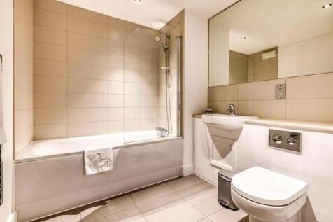 A modern and clean bathroom suite featuring a l...