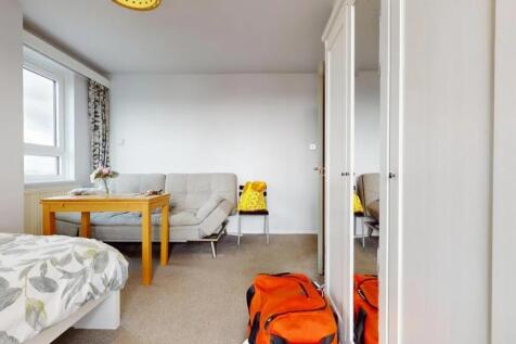 Bright and tidy double bedroom featuring a comf...