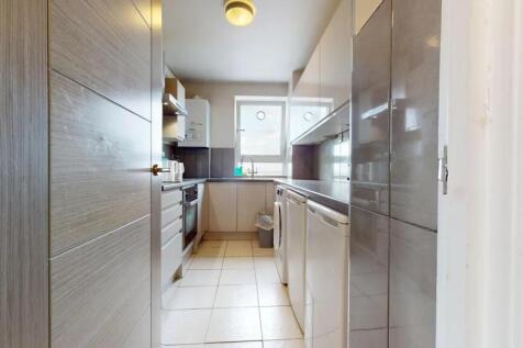 Bright and modern kitchen featuring ample count...