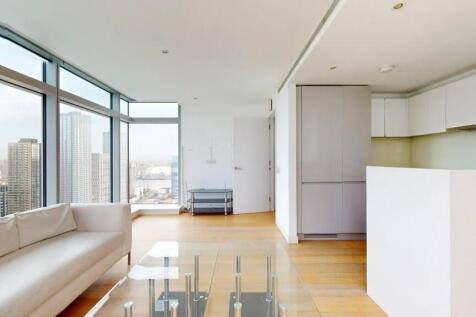 A bright and modern living room with floor-to-c...
