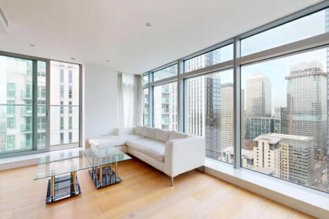 A stylish living room featuring a modern white ...