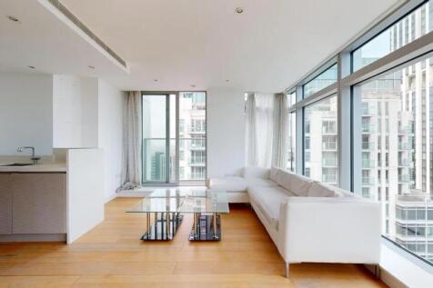 Bright and modern living room featuring floor-t...