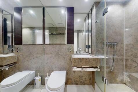 A modern and stylish bathroom suite featuring s...