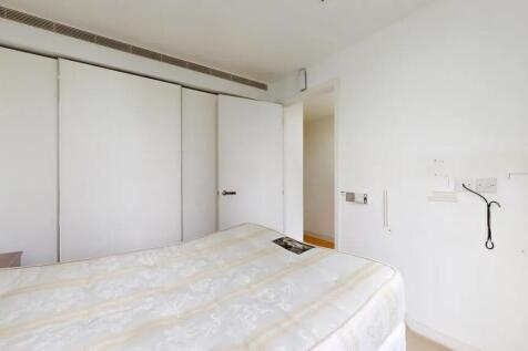 A bright and tidy double bedroom featuring a la...