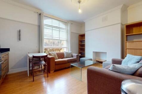 Bright and welcoming living room featuring larg...