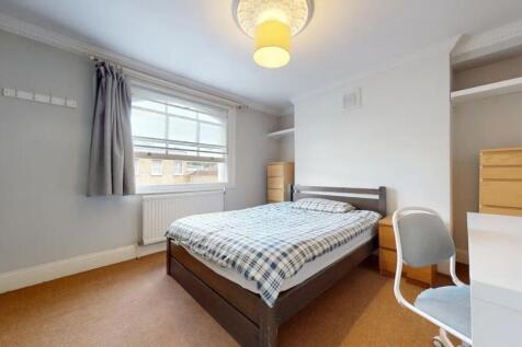 A bright and inviting double bedroom featuring ...