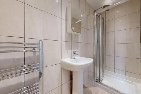 Bright and well-maintained bathroom featuring a...
