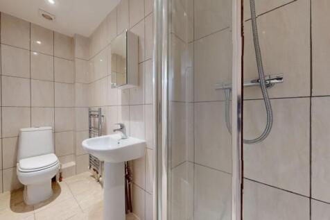 A modern bathroom featuring a clean white toile...