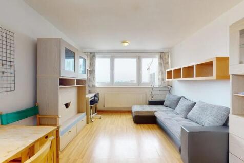 Bright and tidy living room featuring a large w...