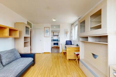 Bright and tidy living room with light wooden f...