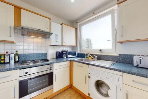 Bright and well-maintained kitchen featuring mo...
