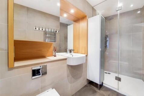 A modern and spotless bathroom suite featuring ...