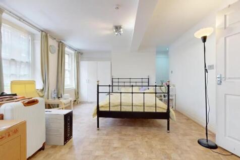Bright and spacious master bedroom featuring a ...
